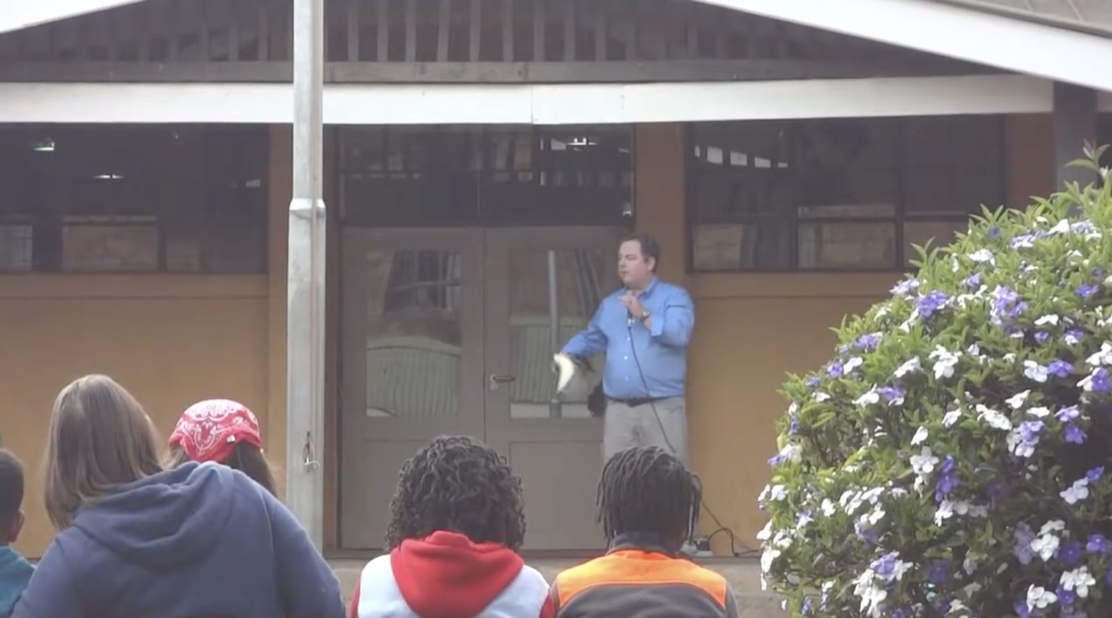 Chad speaking to students outdoors